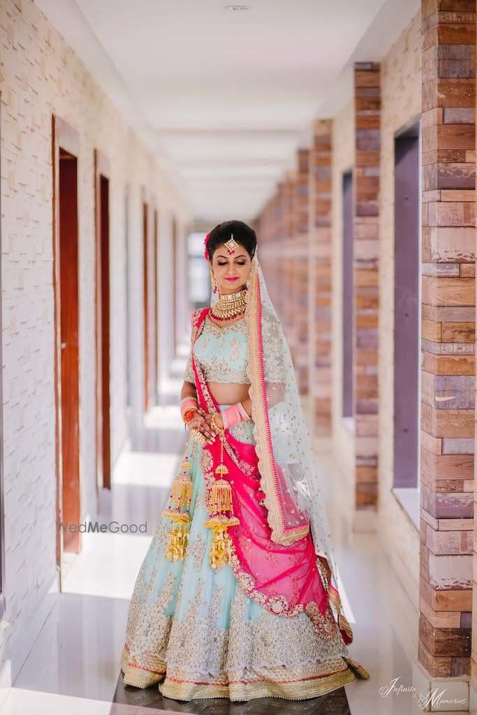 Photo of A bride in powder blue lehenga.