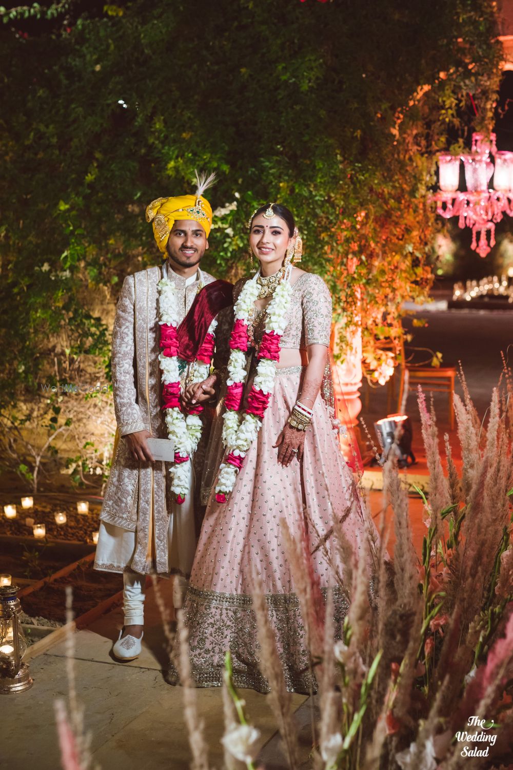 Photo of post wedding couple portrait with unique jaimalas