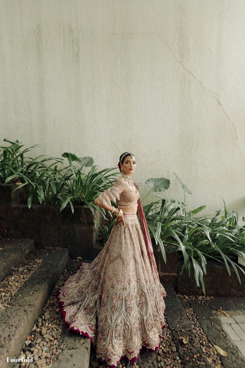 Photo of Gorgeous Tarun tahiliani lehenga with a statement blouse with tassels