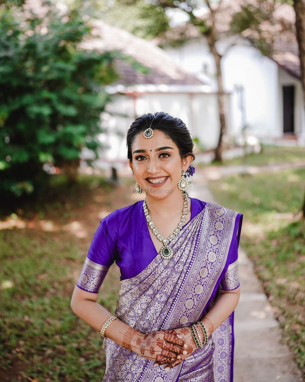 Photo of South Indian bride in a purple kanjeevaram saree