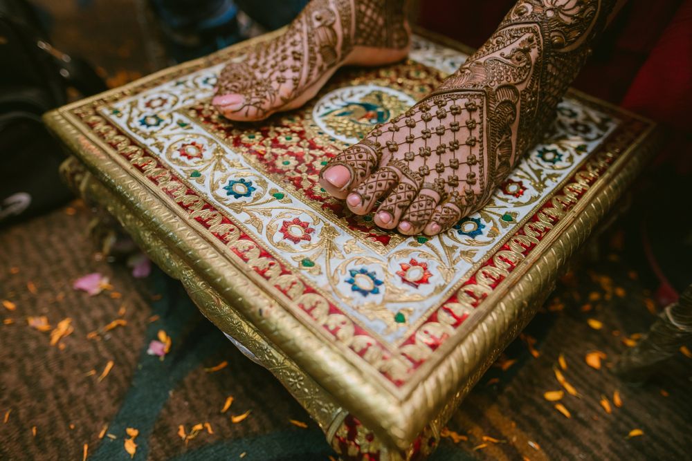 Photo of An intricate feet mehndi design.