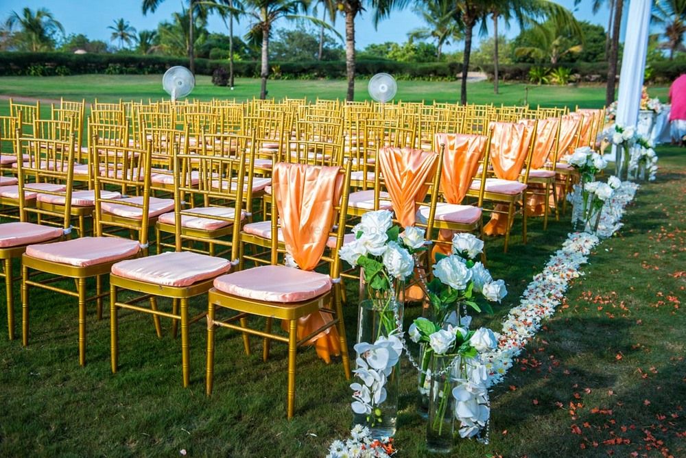 Photo of Chair decor with peach fabric and white