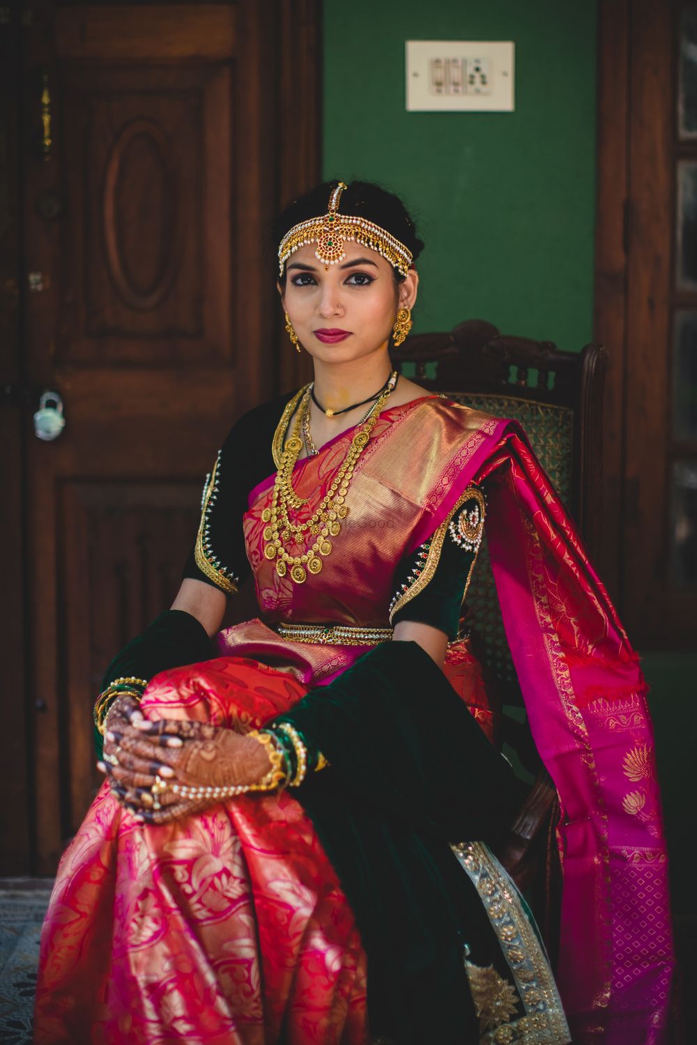 Photo of A bride in a pink and green kanjeevaram saree