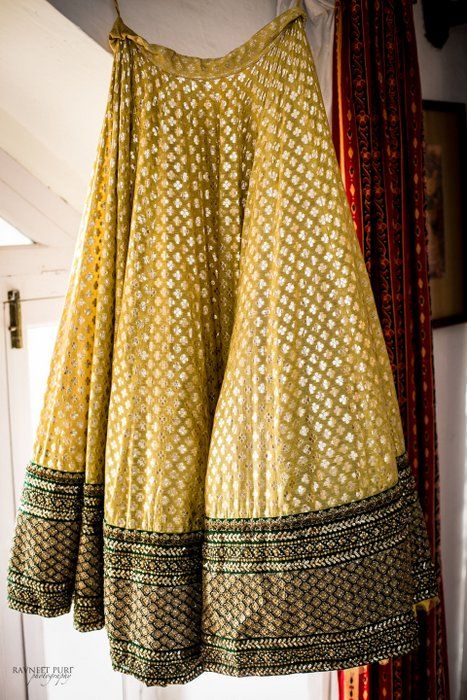 Photo of Cream offwhite sabyasachi lehenga with border