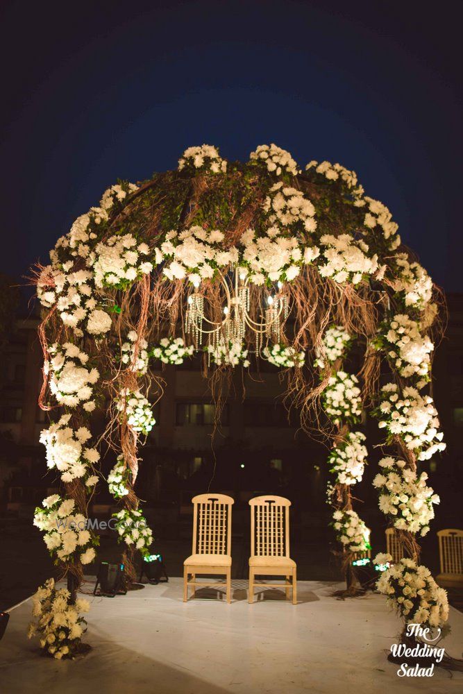 Photo of elegant white and green mandap