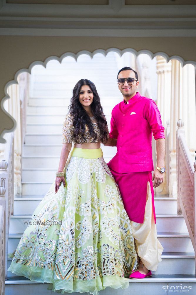 Photo of Lime green lehenga for mehendi on bride byAbu Jani