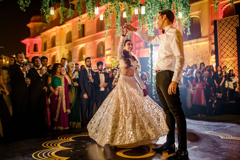 Photo of Bride and groom performing first dance.