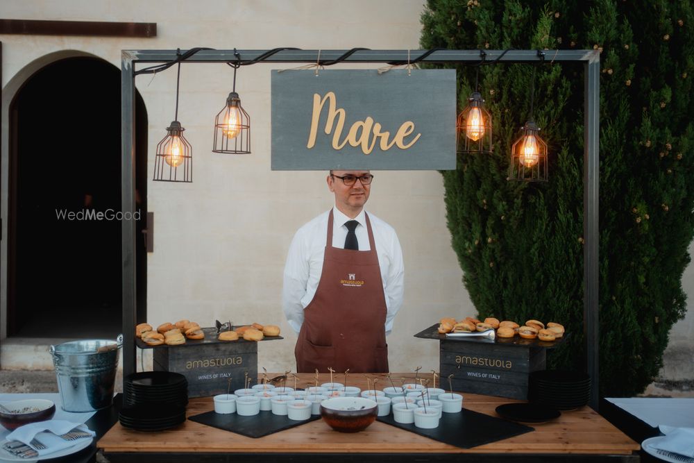 Photo of Unique food set up for an outdoor European wedding