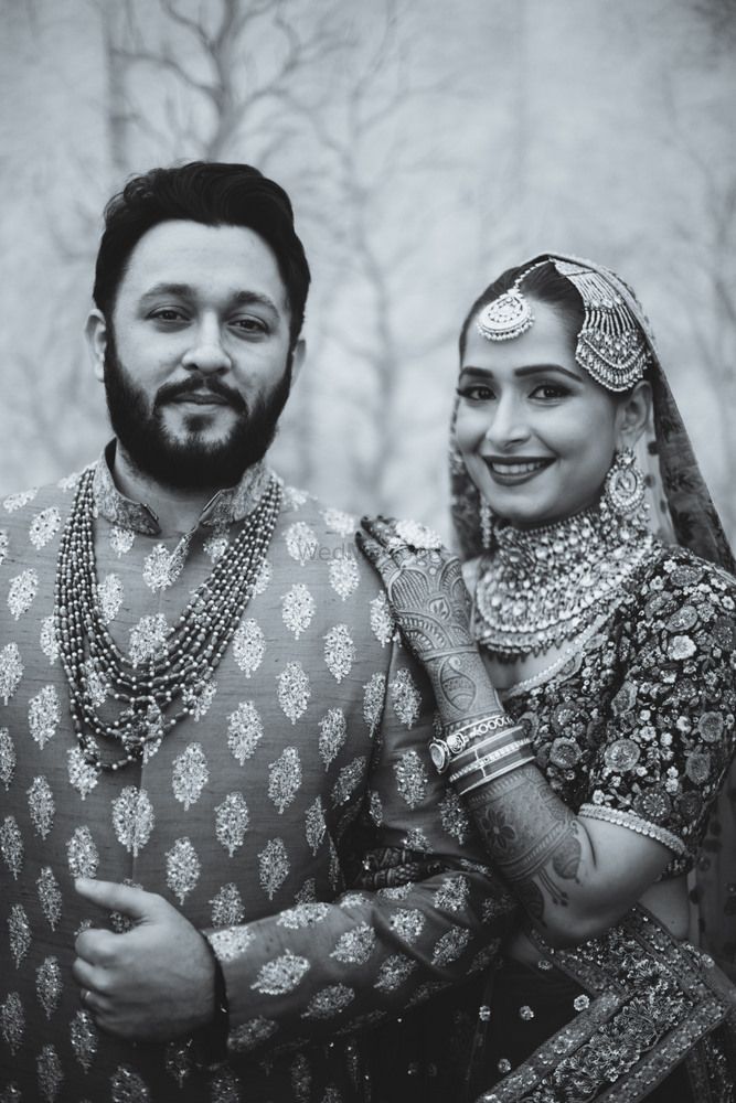 Photo of Black and white royal bridal couple indian