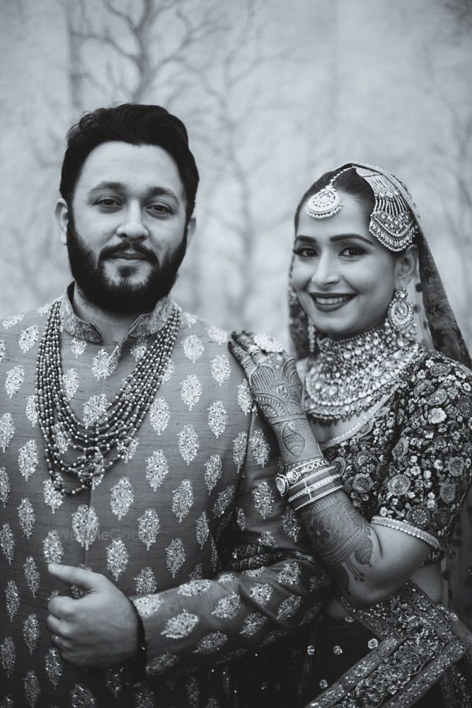 Photo of Black and white royal bridal couple indian