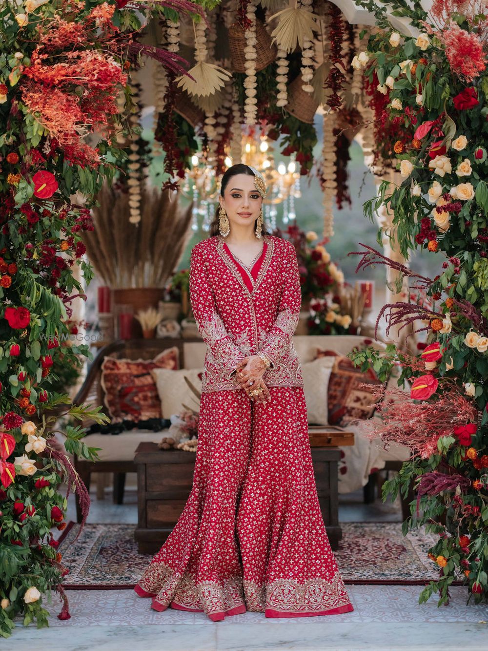 Photo of Stunning jacket style red sharara for the mehendi with gold jewellery