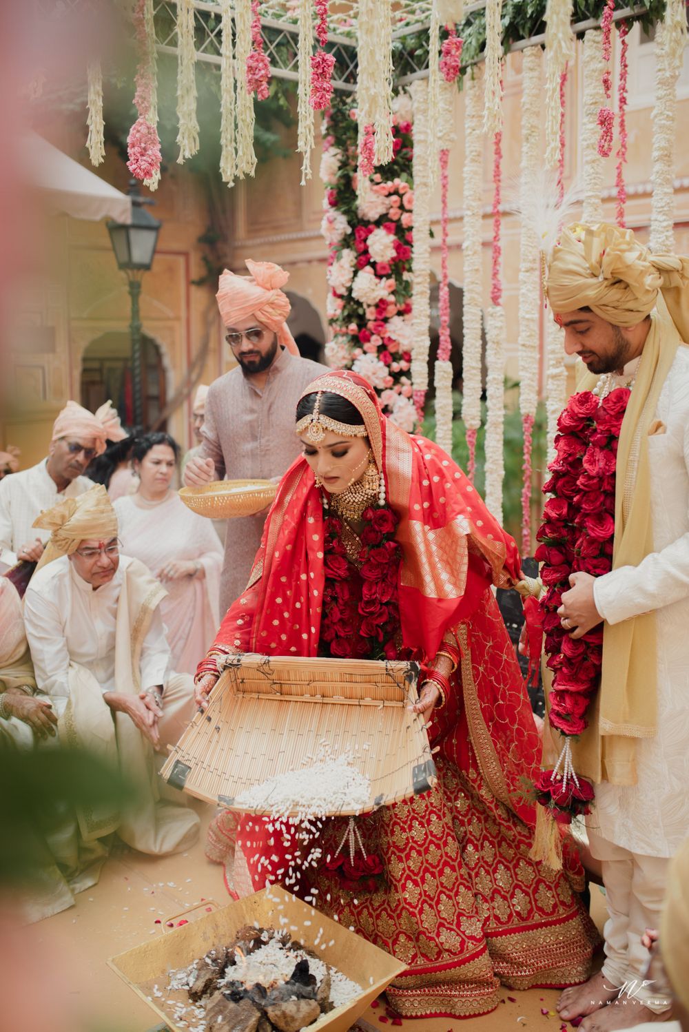 Photo of couple while doing rituals shot during wedding