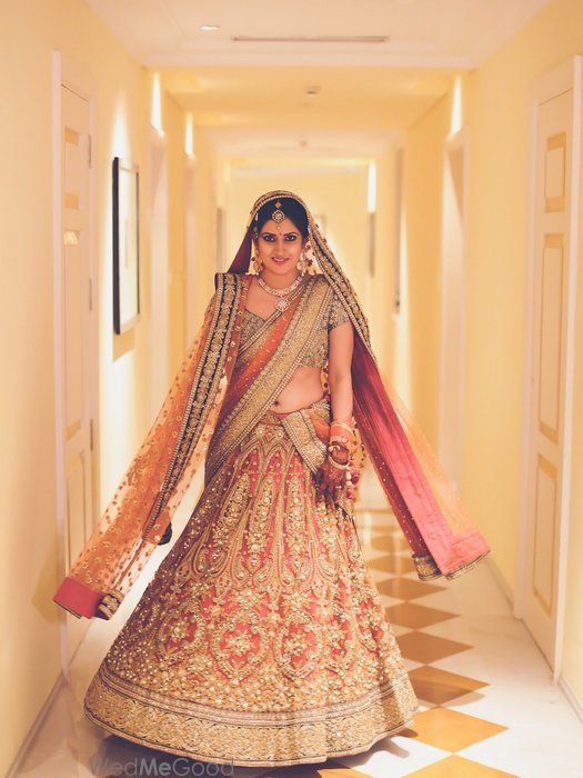 Photo of Sabyasachi Bridal Lehenga in Peach with pearl work