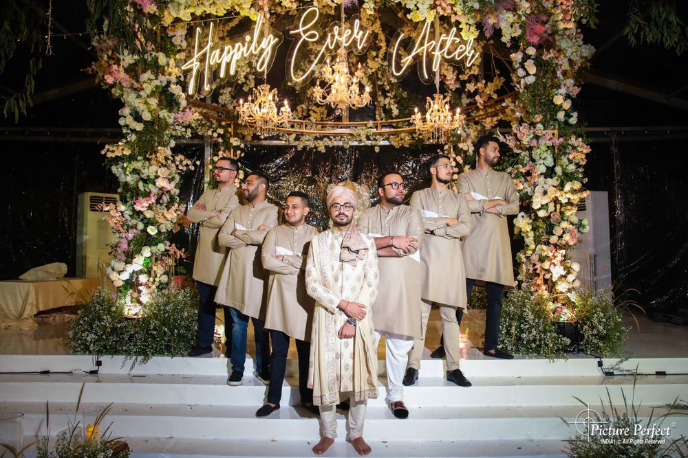 Photo of groom with his matching groomsmen in beige kurtas