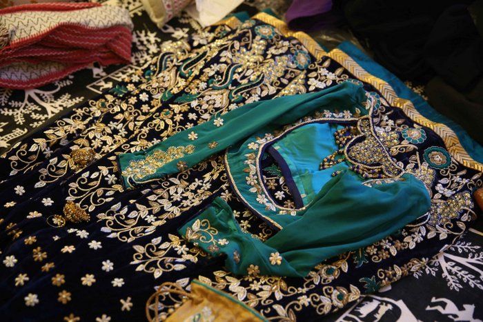 Photo of blue velvet lehenga for sangeet with white and gold embroidery