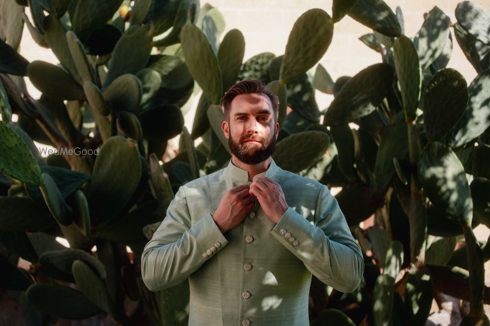 Photo of Groom in a stunning sage green sherwani for his wedding day