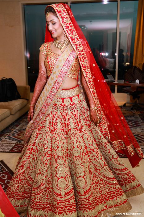 Photo of Red all over embrpidered bridal lehenga
