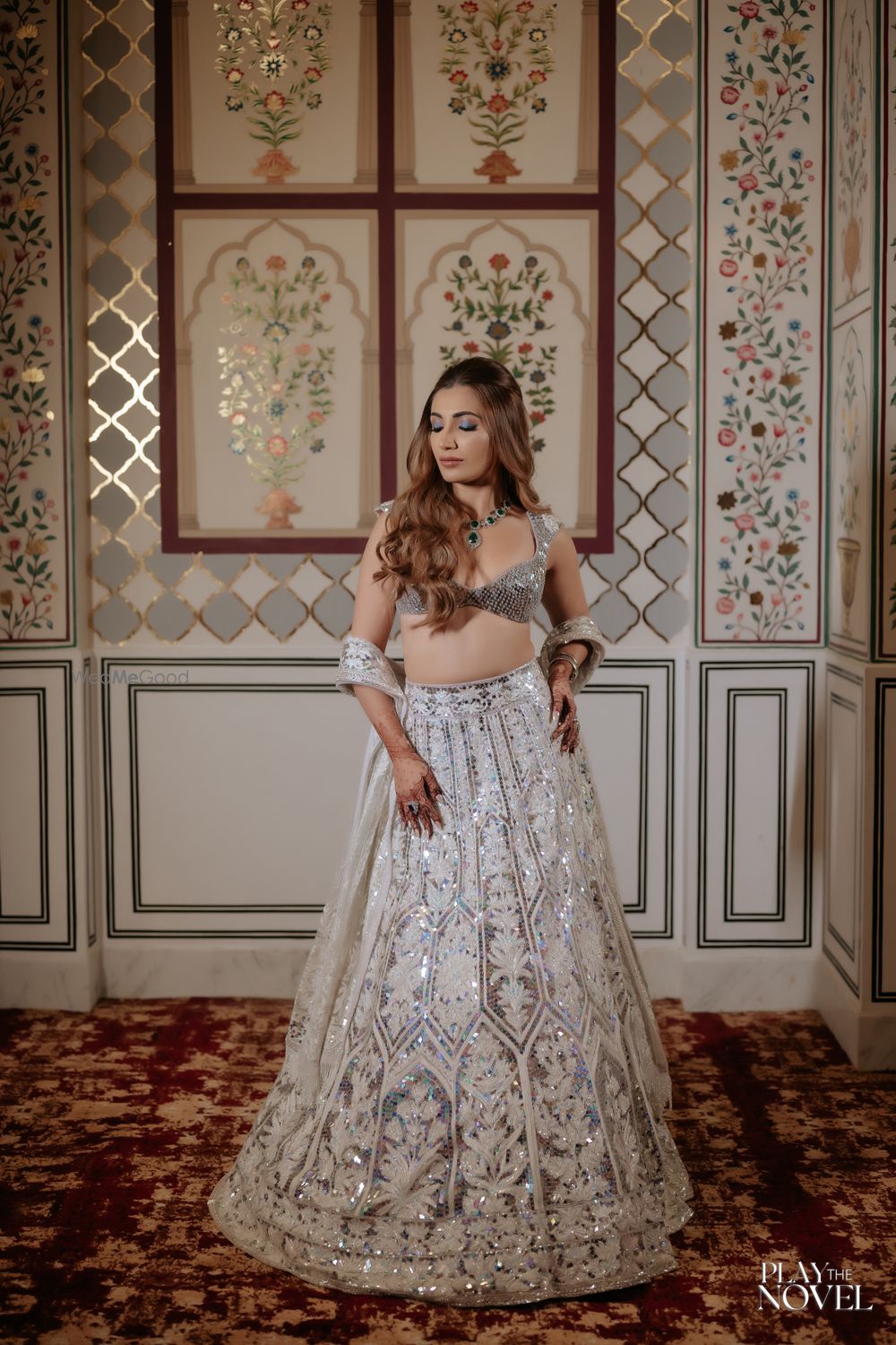 Photo of Gorgeous bridal sangeet lehenga in silver and white with a bralette style all-silver blouse