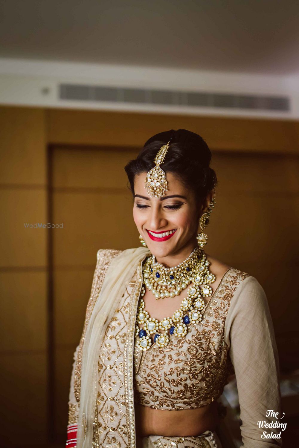 Photo of off white lehenga gold lehenga