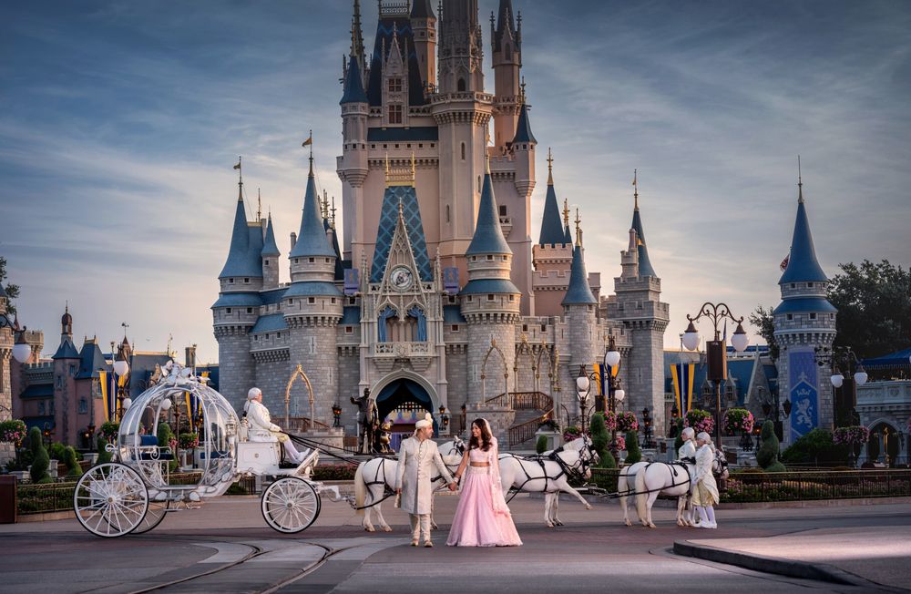 Photo of Indian bride and groom pose at Disney World Orlando for their wedding