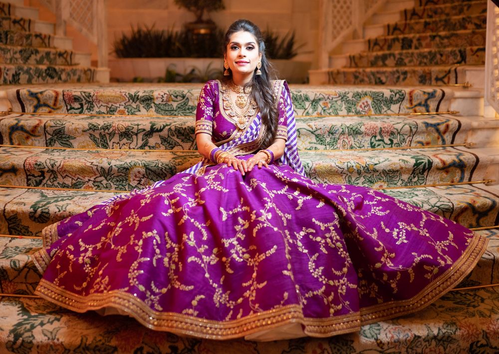 Photo of A bride in a purple outfit for her sangeet