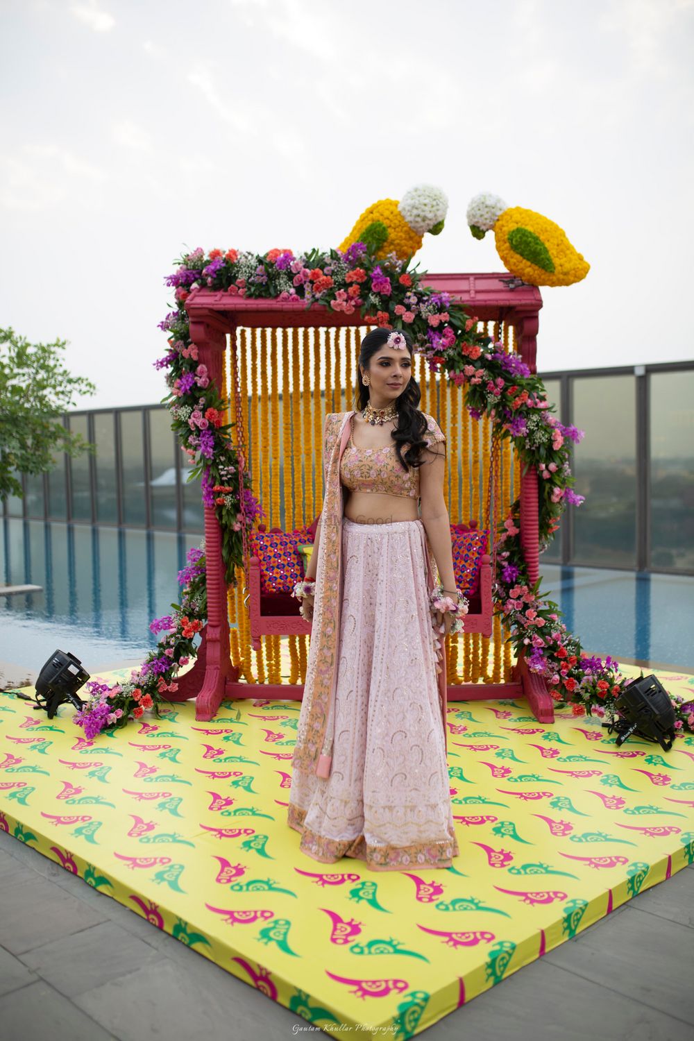 Photo of Mehendi bridal swing with floral bird decor