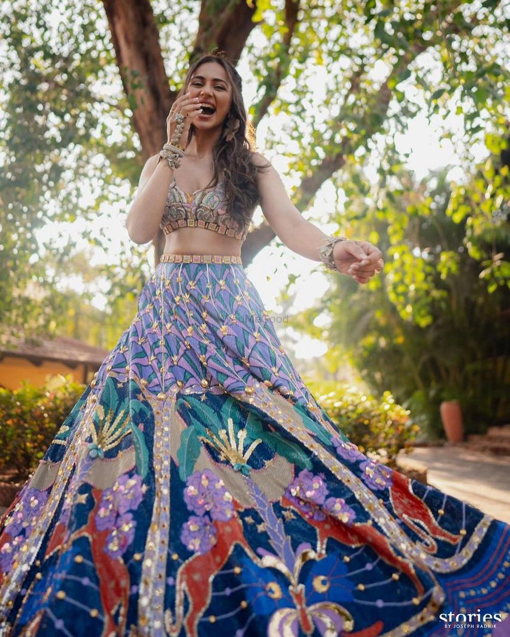 Photo of Happy shot of the bride twirling with a unique haathphool