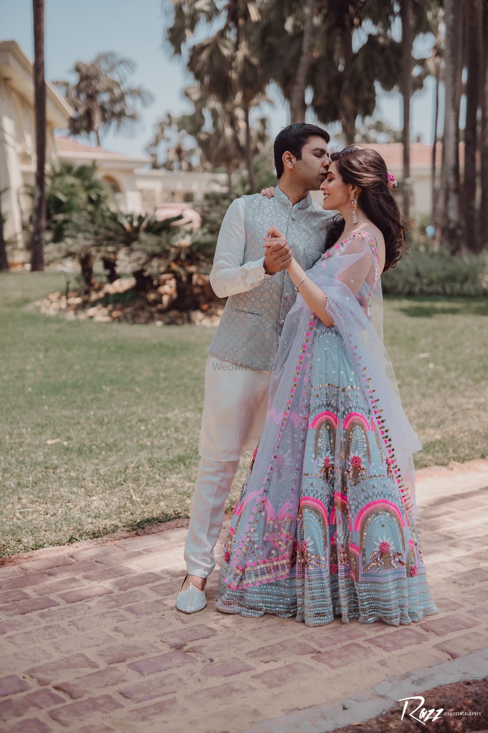Photo of candid shot of a bride and groom from their Mehendi.