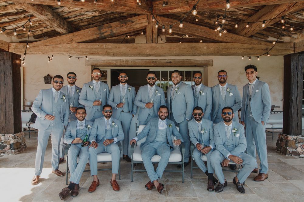 Photo of Groom with groomsmen in colour coordinated outfits!
