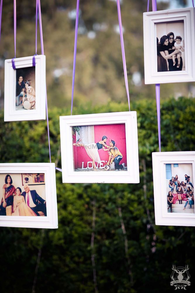 Photo of Hanging frames with couple photos