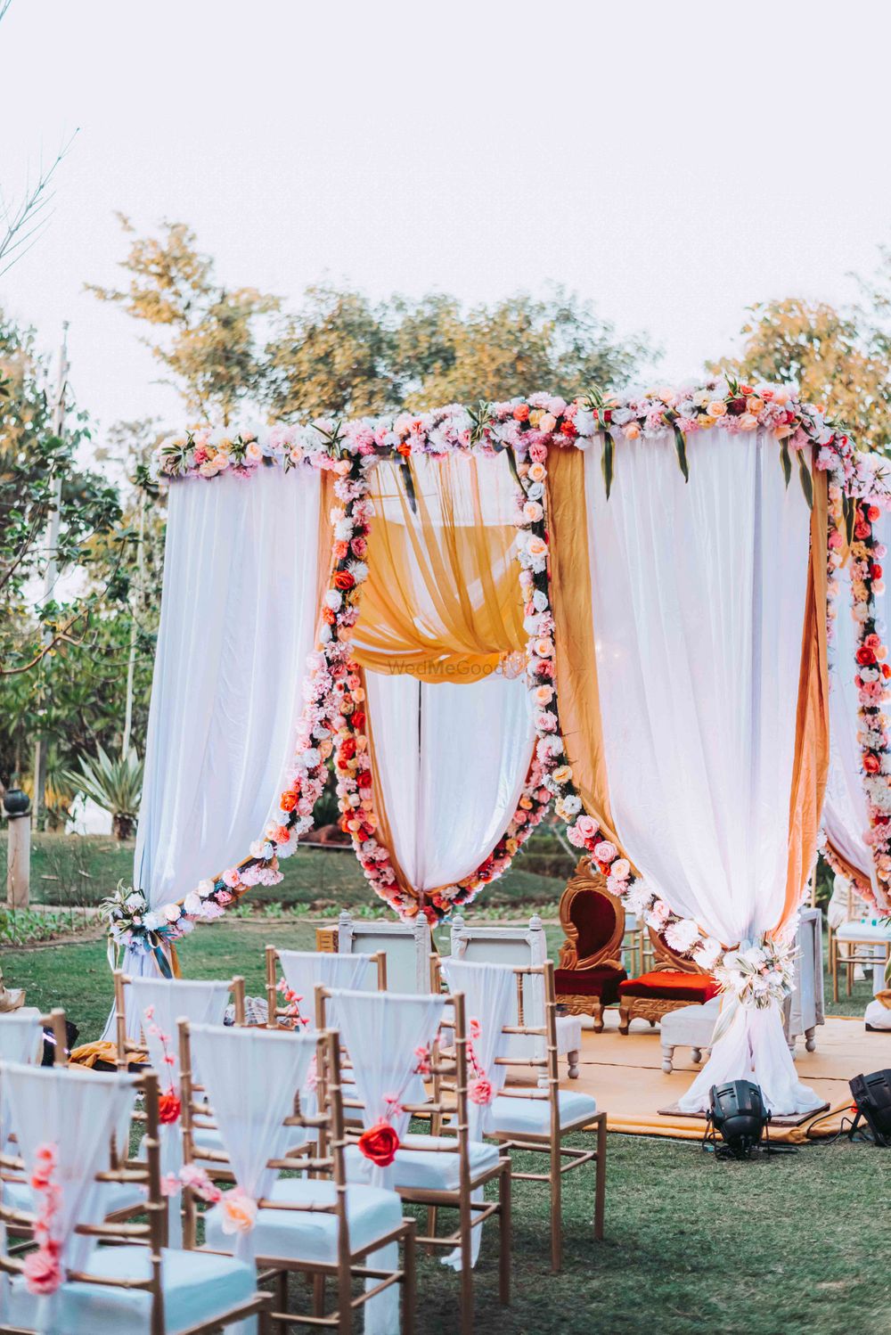 Photo of simple pink and white mandap for an intimate wedding