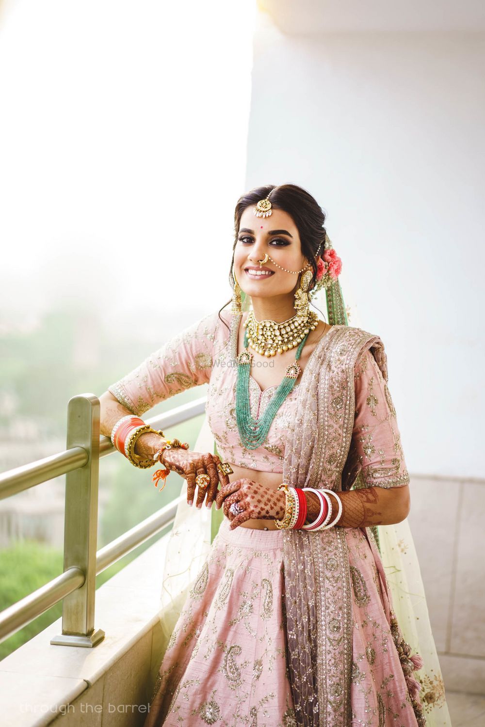 Photo of Happy pastel bride contrasting jewellery