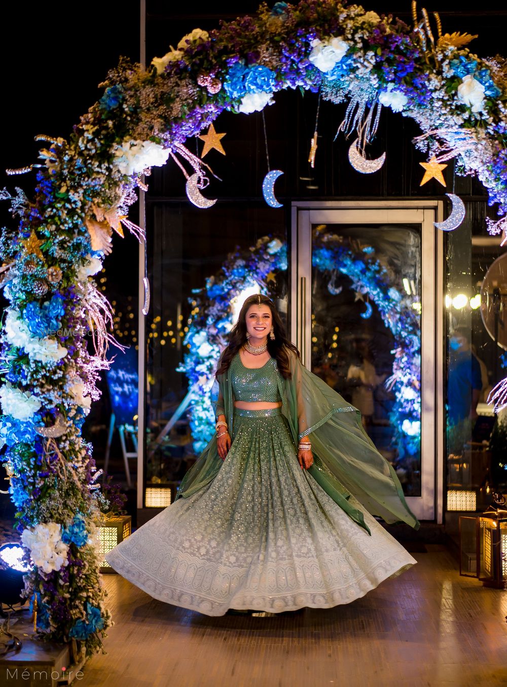 Photo of twirling bride shot at the sangeet