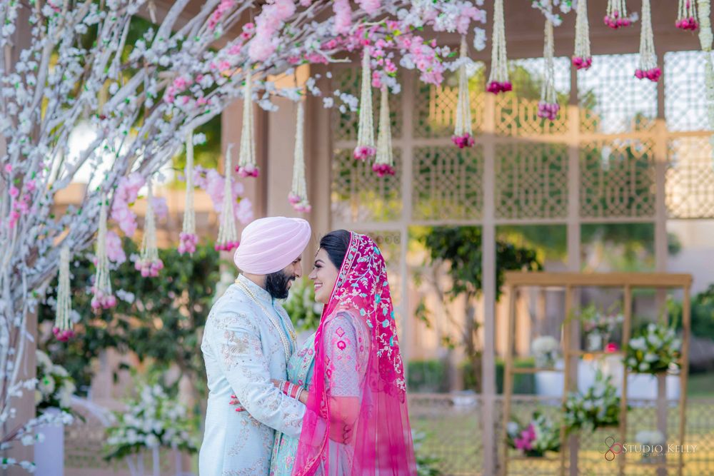 Photo of sikh couple shot on wedding day with coordinated outfits