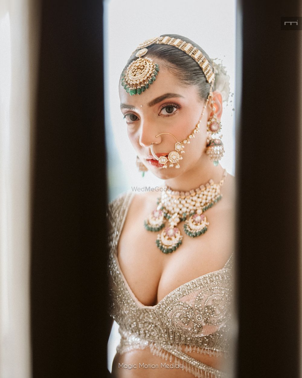 Photo of Unique shot of the bride with statement jewellery on her wedding day