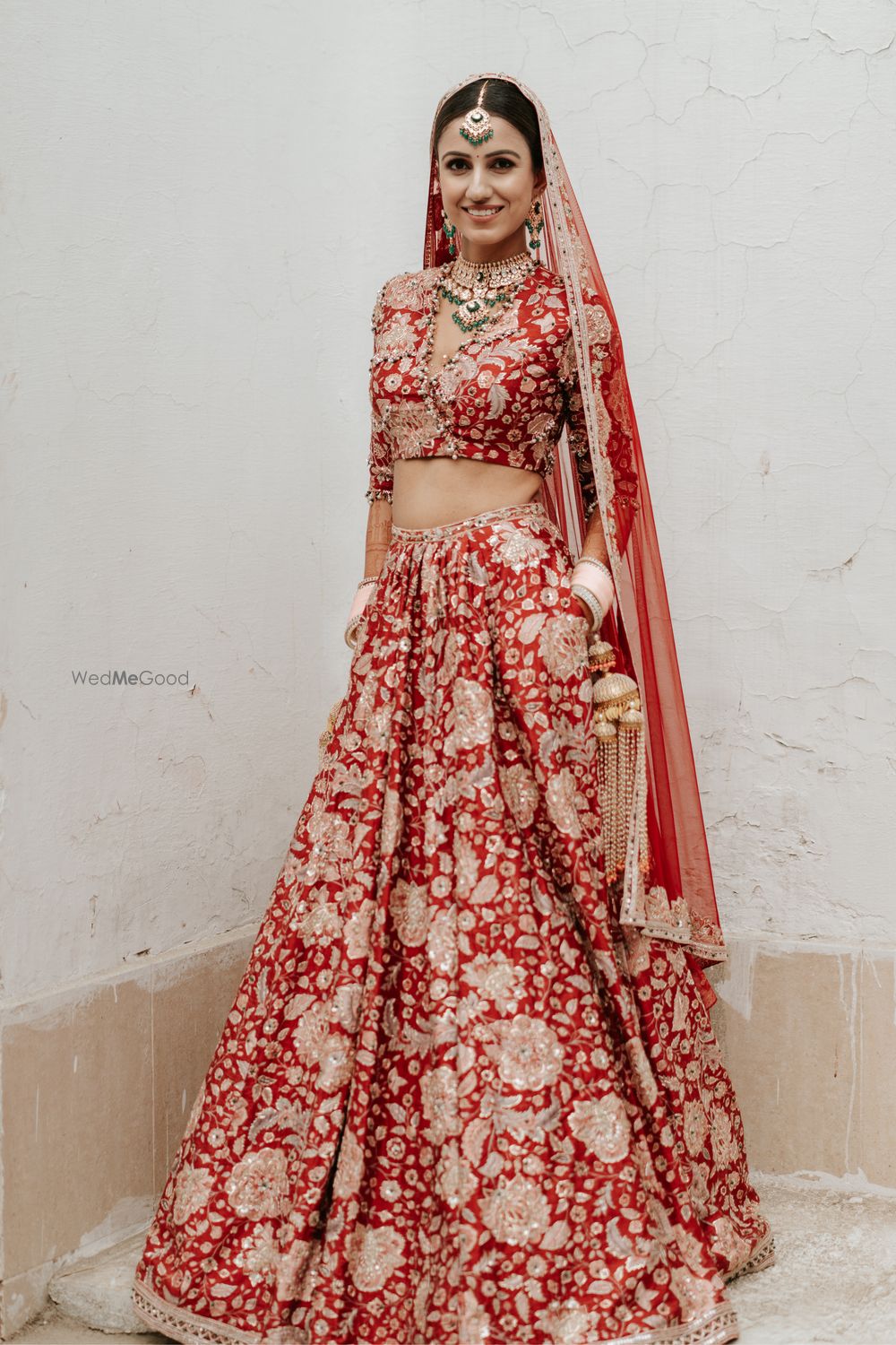 Photo of Unique bridal red lehenga with gold work and pockets!
