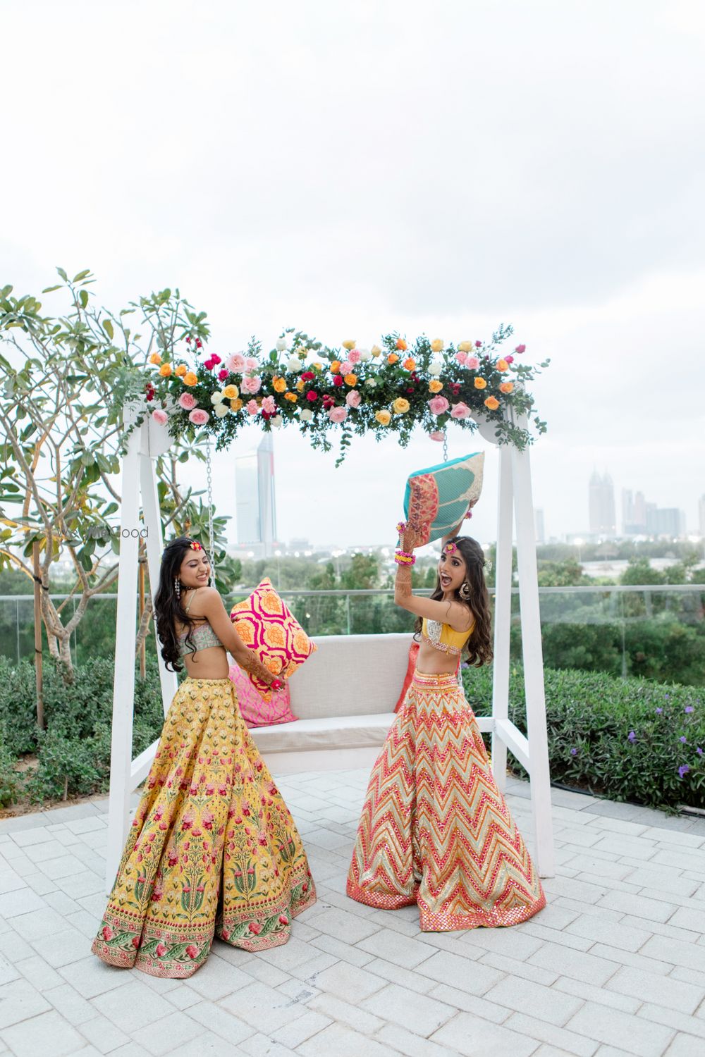 Photo of Candid shot of a bride and her sister having fun.