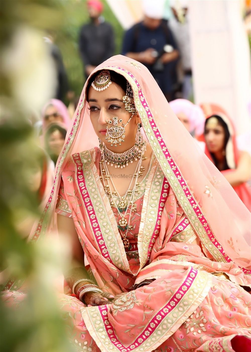 Photo of Sikh bride in pastel pink sharara with  large nosering