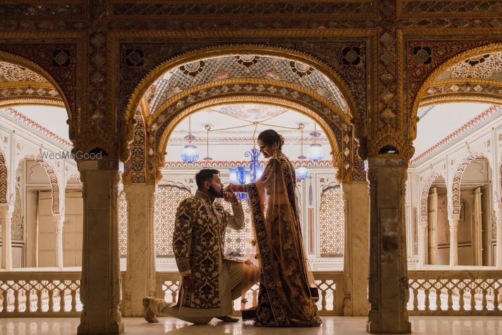 Photo of Pre wedding shoot idea with proposal shot in palace