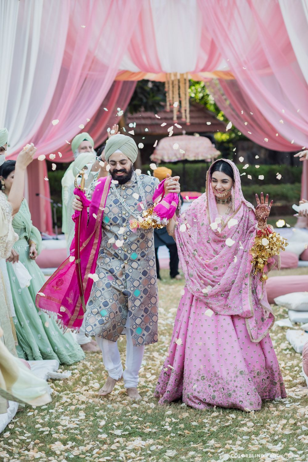 Photo of Bright, happy, candid couple shot on Anand Karaj