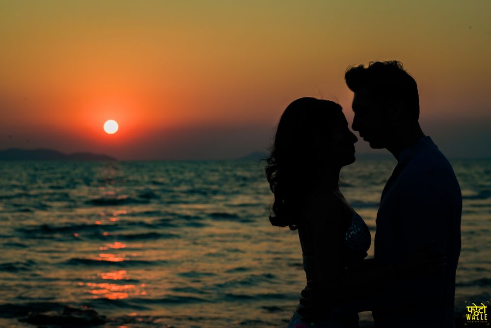 Photo of pre wedding or honeymoon sunset shot on the beach