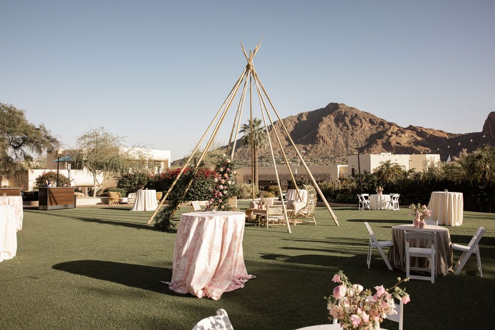 Photo of simple pastel decor idea with teepee for backyard wedding