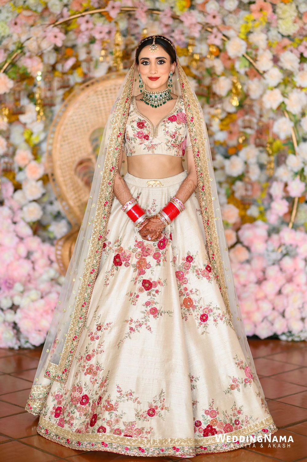 Photo of Bride wearing an offbeat white floral Sabyasachi lehenga