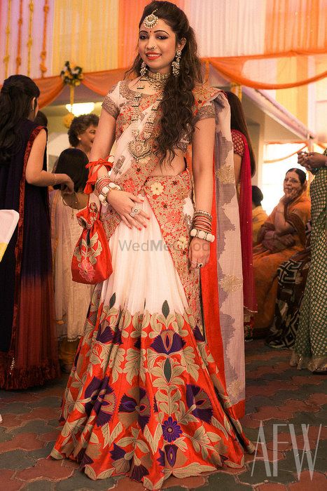 Photo of white and red lehenga