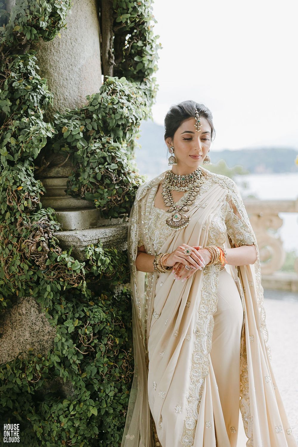 Photo of bride in white saree portrait