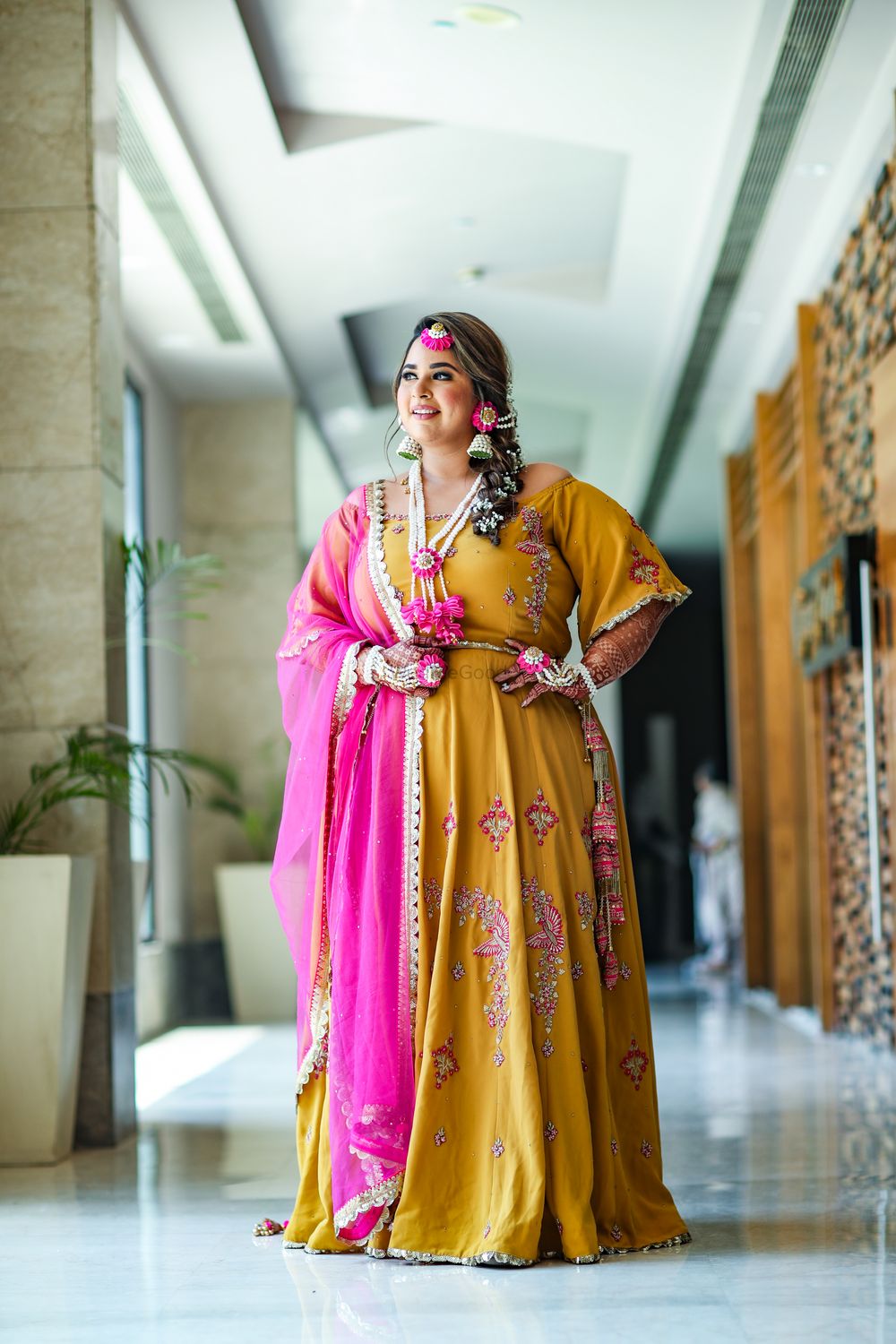 Photo of plus sized bride in yellow and pink anarkali