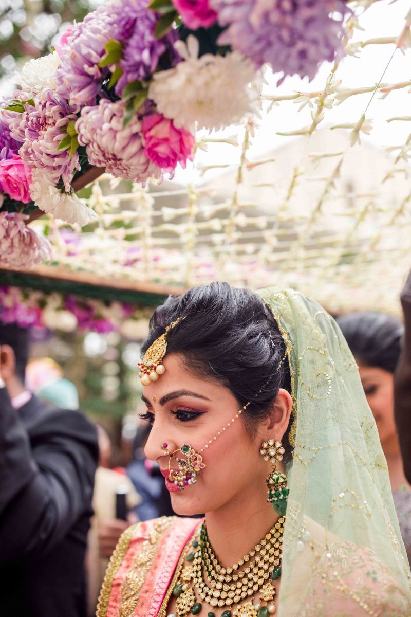 Photo of Bride entering wearing elaborate nosering