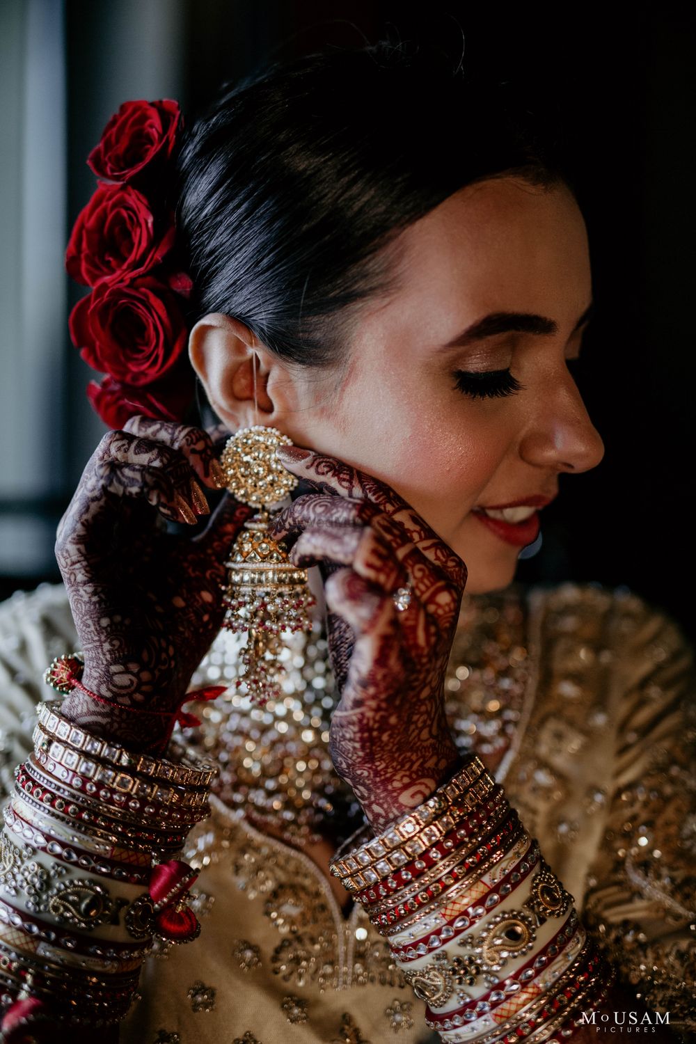 Photo of bridal shot wearing her gold earrings