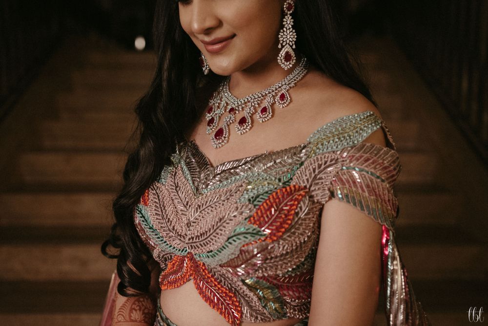 Photo of bride for cocktail in unique blouse with diamond and ruby jewellery