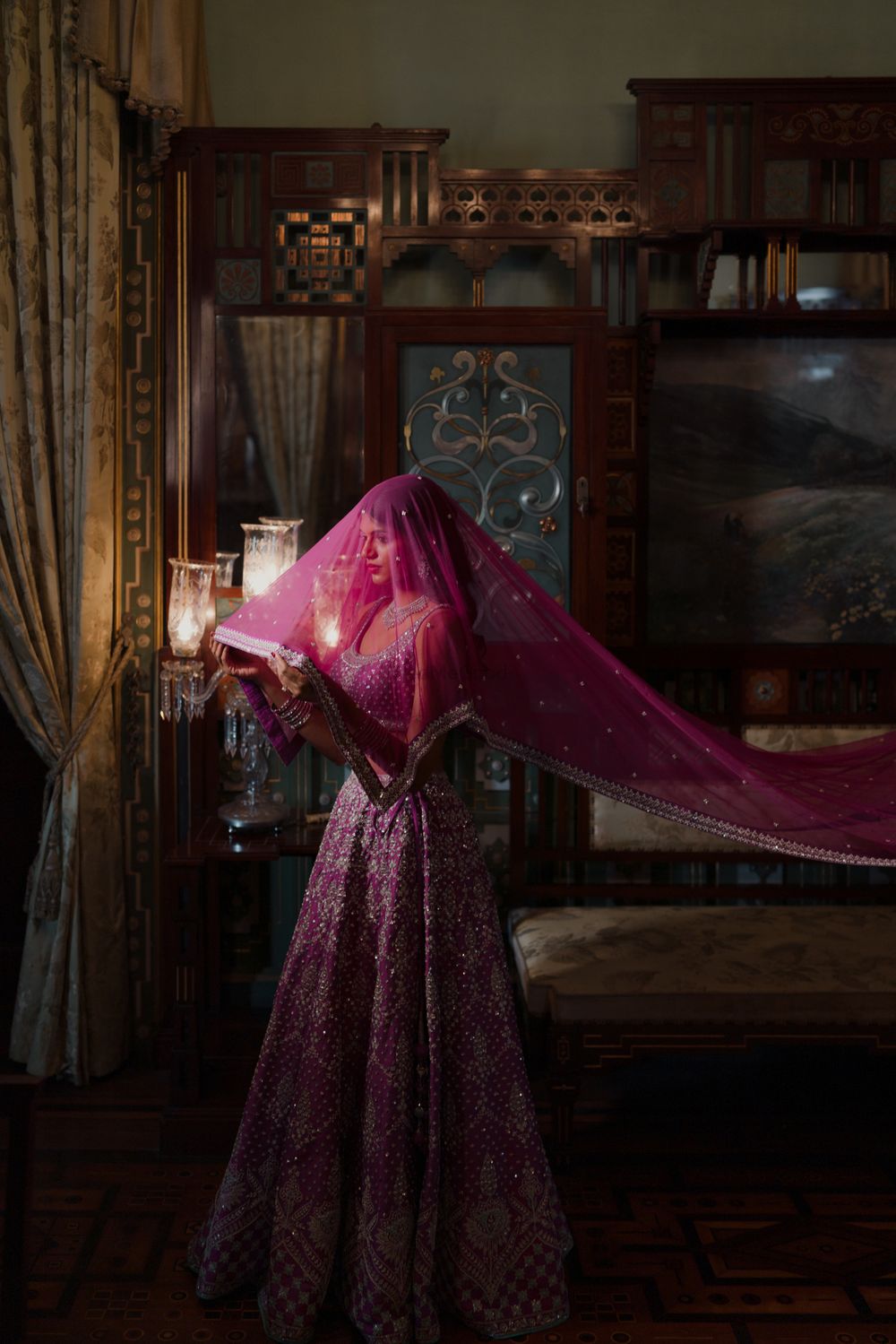 Photo of bride under a veil shot